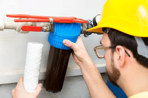 Man changing out water filter